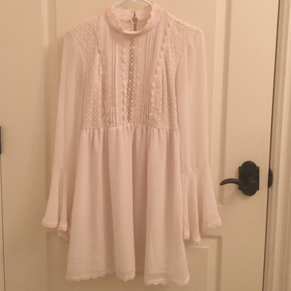 White backless lace dress with bell sleeves
