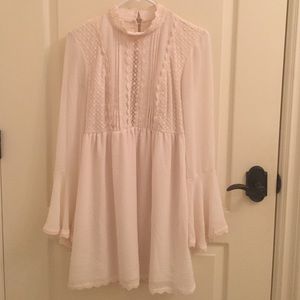 White backless lace dress with bell sleeves