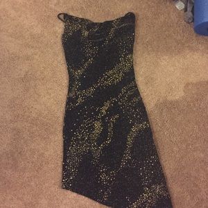 black and gold sparkly dress with asymmetrical hem