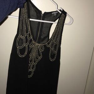 Sheer black top with gold detail