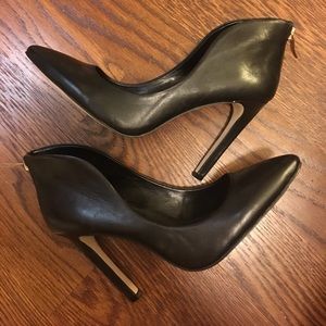 Black leather with beautiful gold zipper on heel!