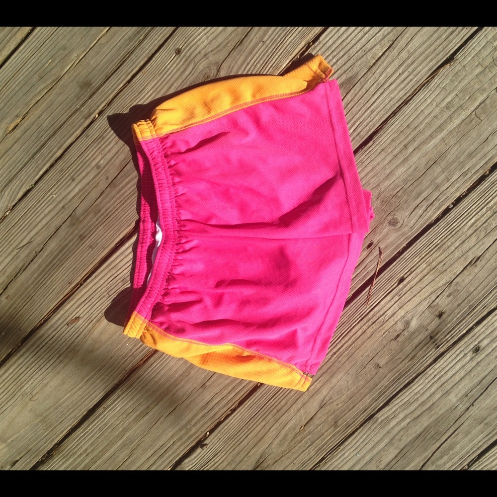 Pink and orange workout shorts.