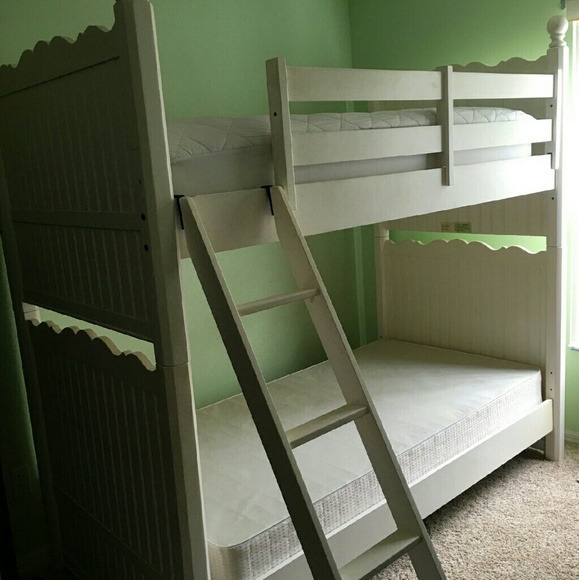 White wooden bunk bed including the two matresess