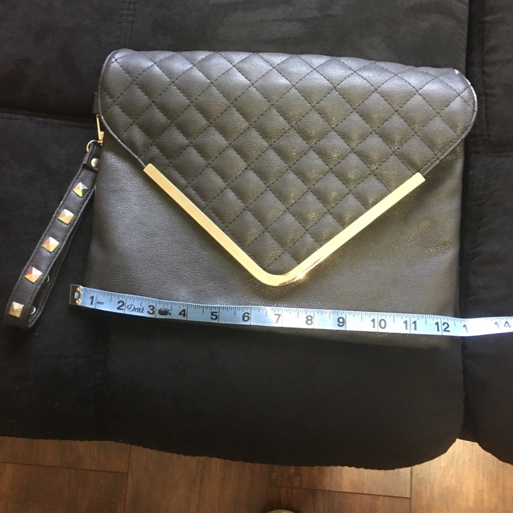 Large black clutch. Man made material.