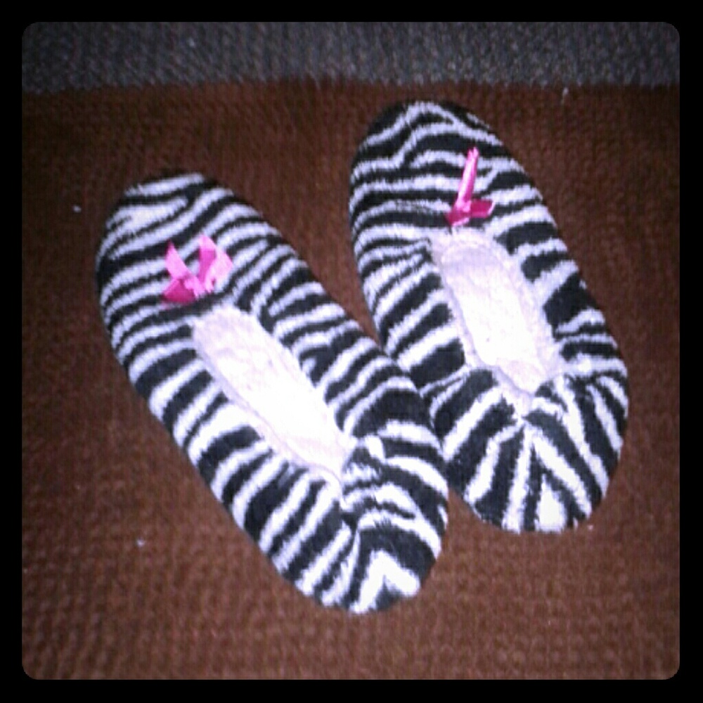 zebra print slippers with a pink bow