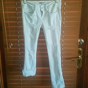 Distressed white jeans