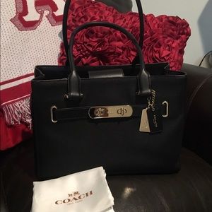 Coach Swagger Carryall in Black pebbled leather.