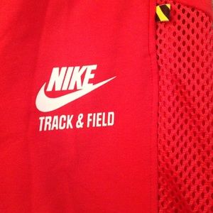 Nike track bottoms with cutout mesh leg strip