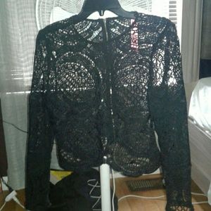 Black knitted shirt with gold accent zipper