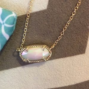 Iridescent white Kendra scott necklace in gold