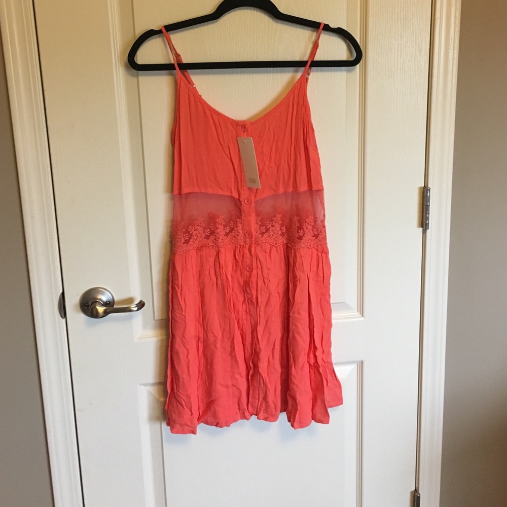 Never worn Tobi coral dress with sheer paneling.