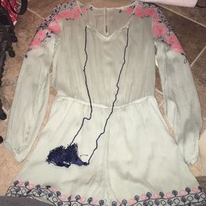 Teal romper with tassels