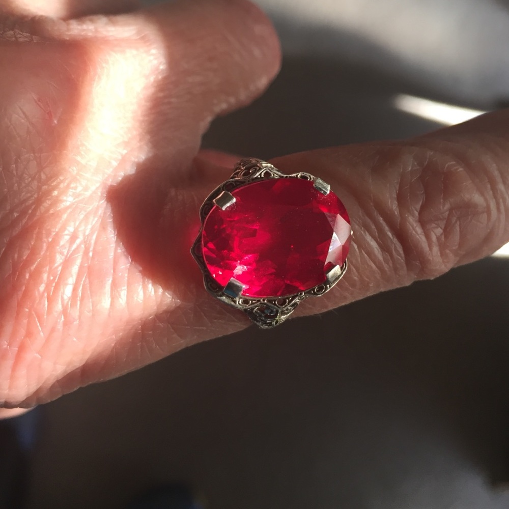 Hallmarked 925, silver and red faceted stone ring,