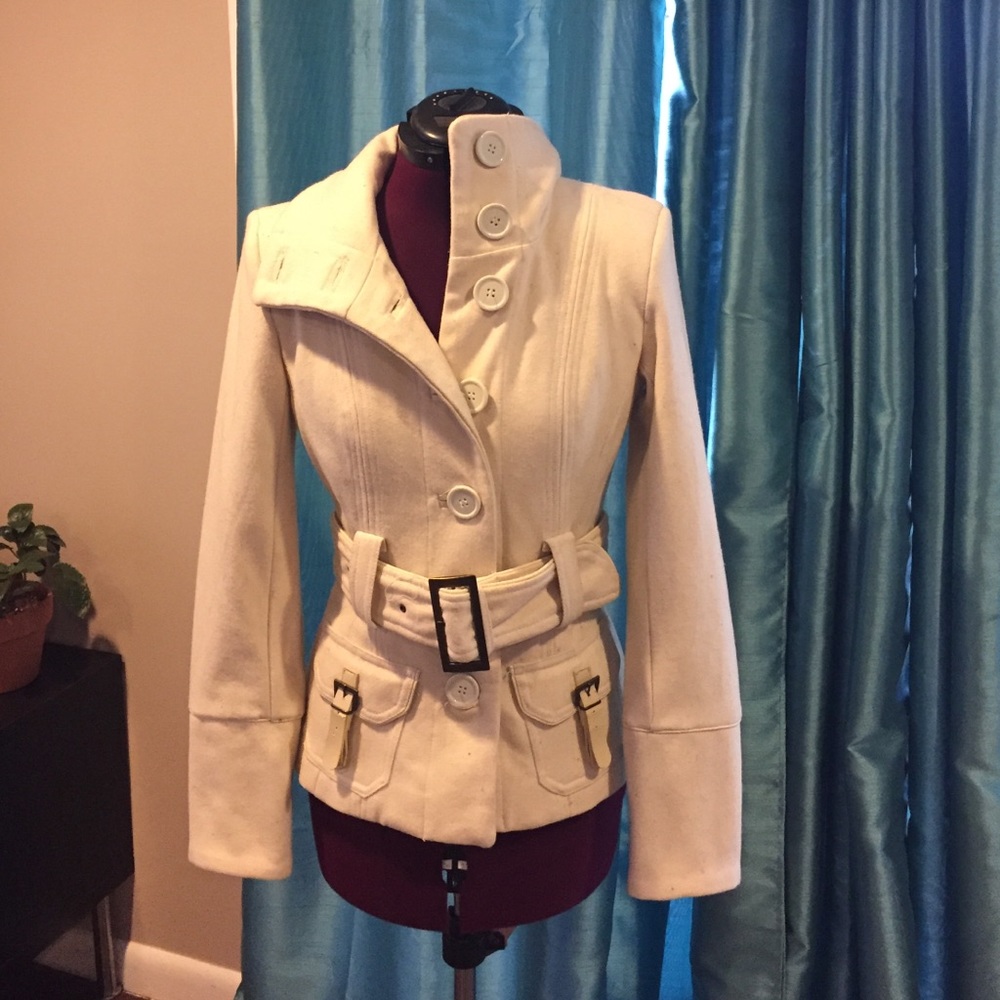 Off-white cream jacket with buttons and belt.