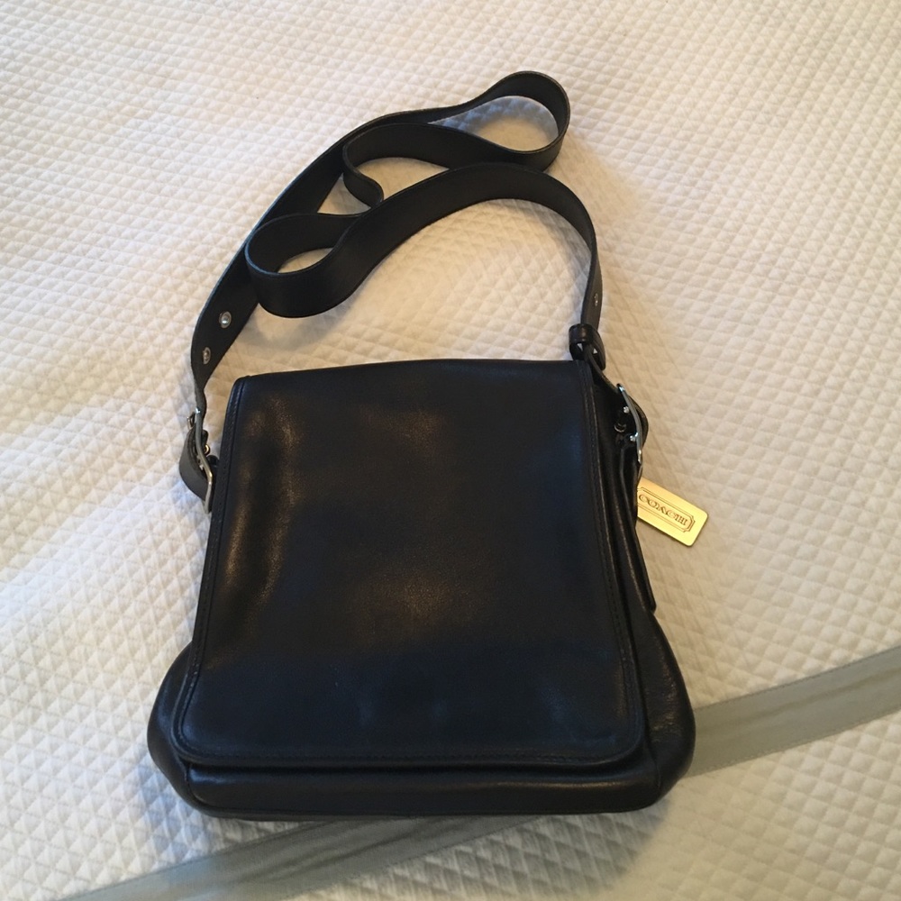 COACH black leather flap purse.