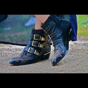 Black leather ankle boots with gold stud hardware