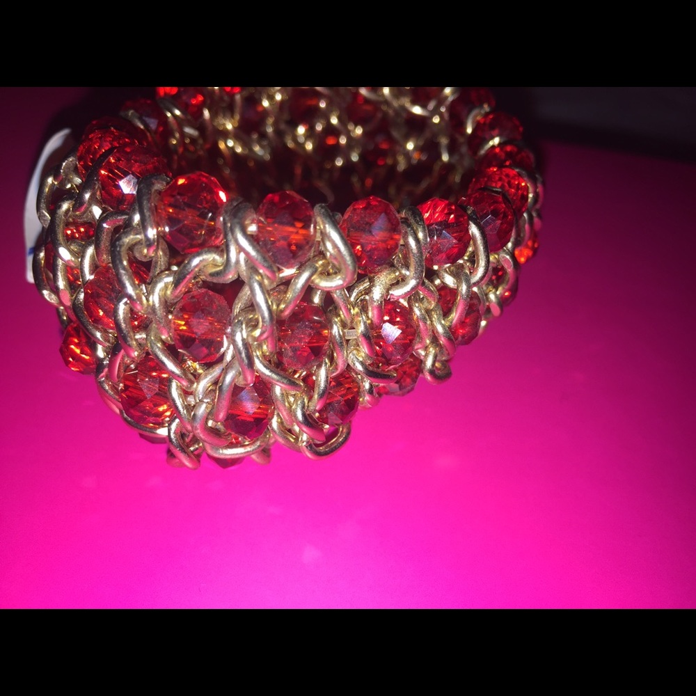 A red bracelet with gold details