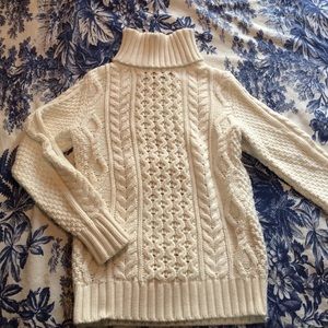 Cream fisherman's knit sweater.