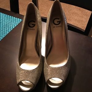 Gold high heels by Guess