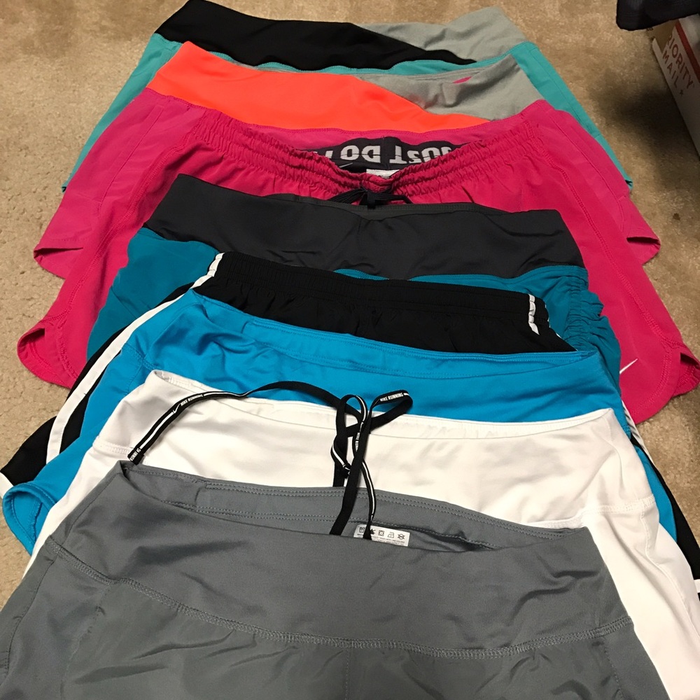 8 pairs of Nike dri-fit running shorts