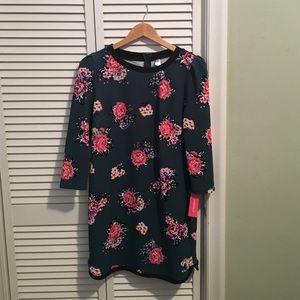 Flowered 3/4 length sleeved dress.