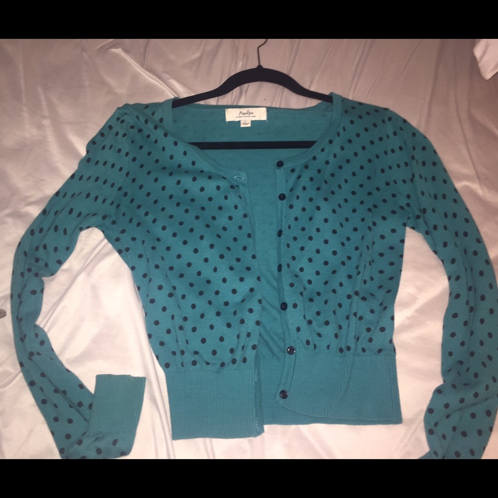 A green cardigan