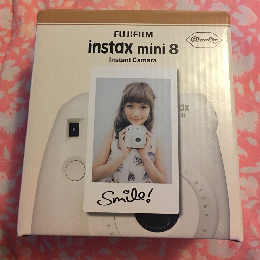 White Polaroid camera. Instax mini 8