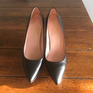 Black leather pumps