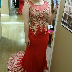 Long, red and gold prom/formal dress with train.