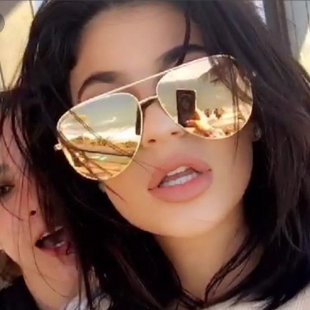 Quay Australia rose gold aviators.