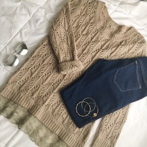 Oversized knit sweater with lace and button detail