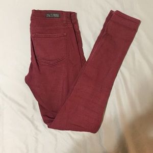 Maroon jeggings.