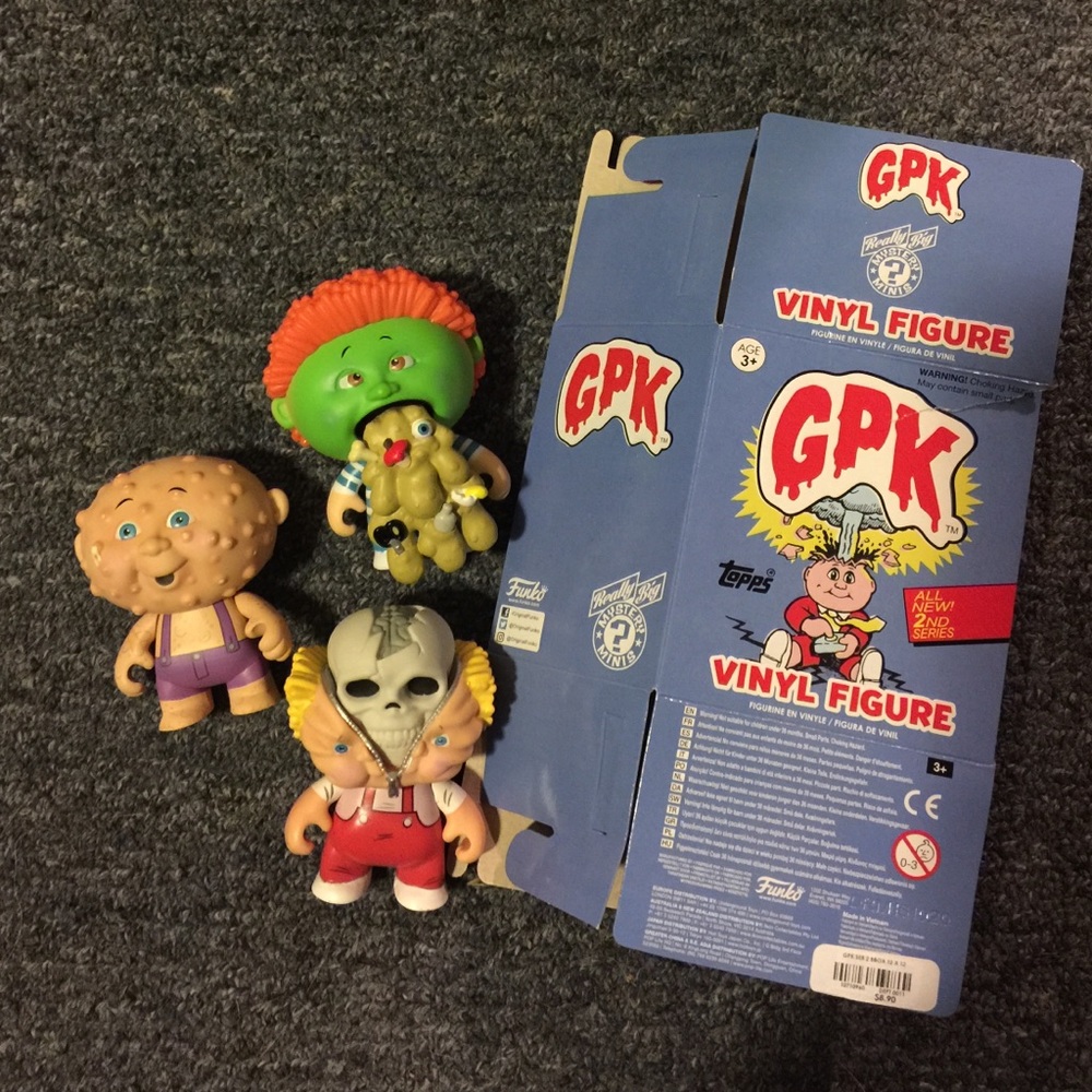 Three GPK funko vinyl figures.