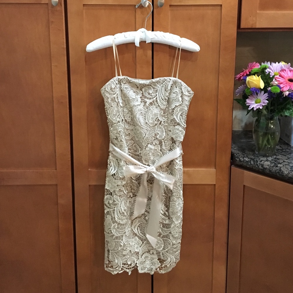 Champagne colored, sleeveless cocktail dress