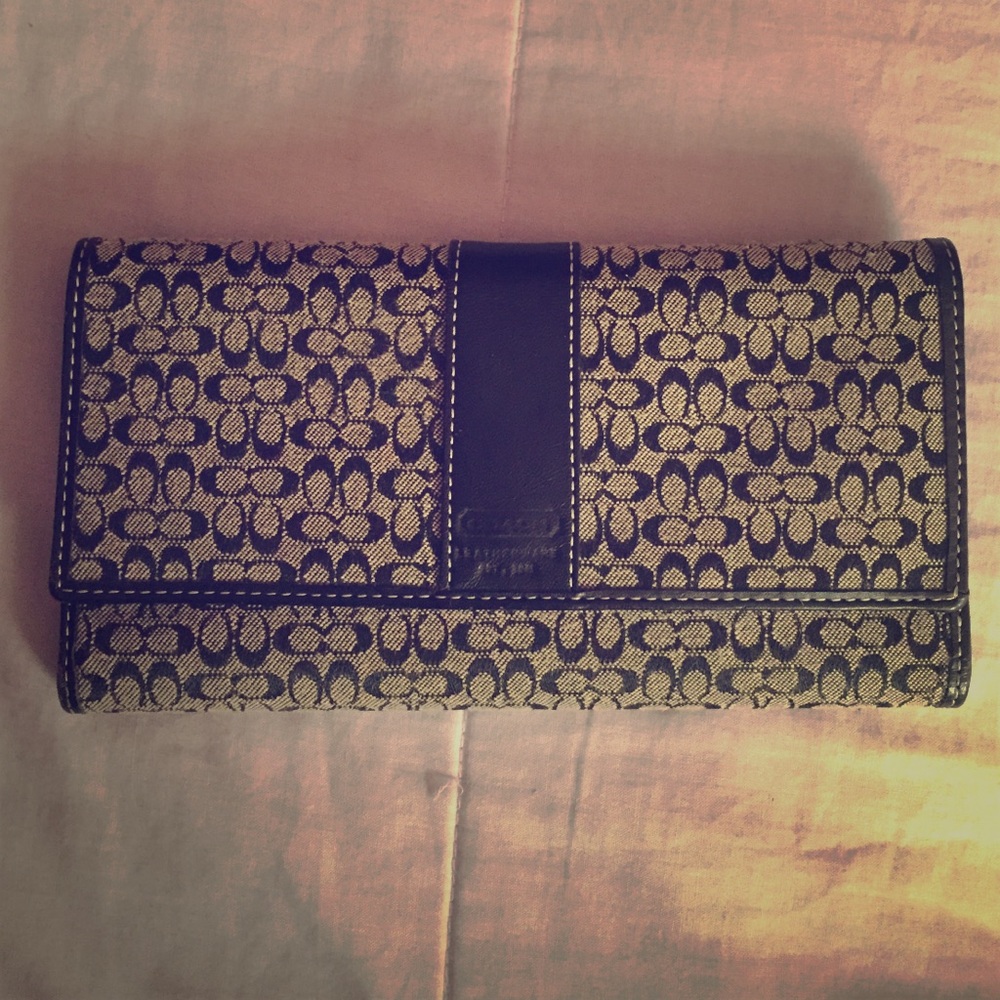 Gray and black trifold Coach wallet