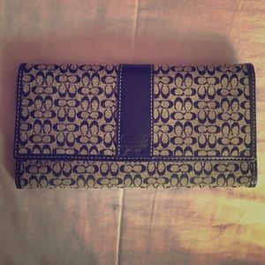 Gray and black trifold Coach wallet