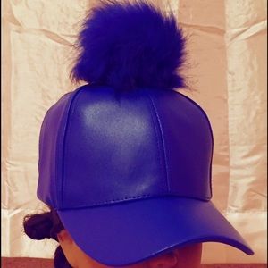 Electric blue hat (non Velcro ) with fur ball