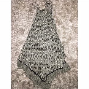 Black and white tie around the neck blouse.