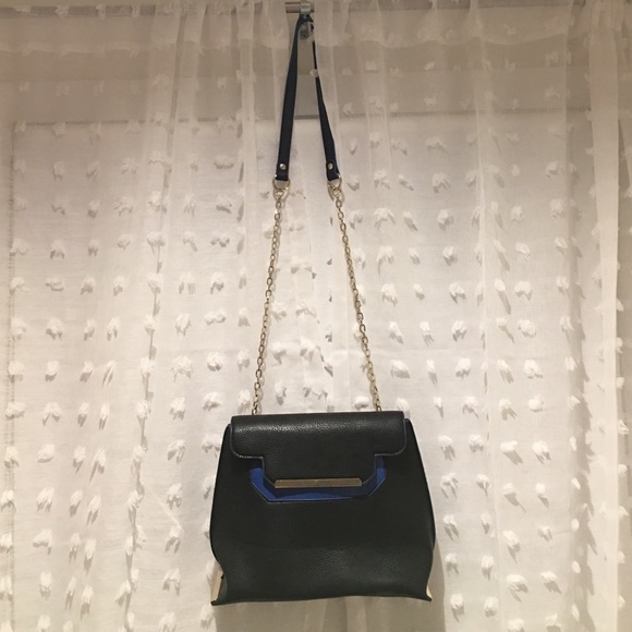poverty riot Handbags - Never worn! Cute black, blue and gold purse!