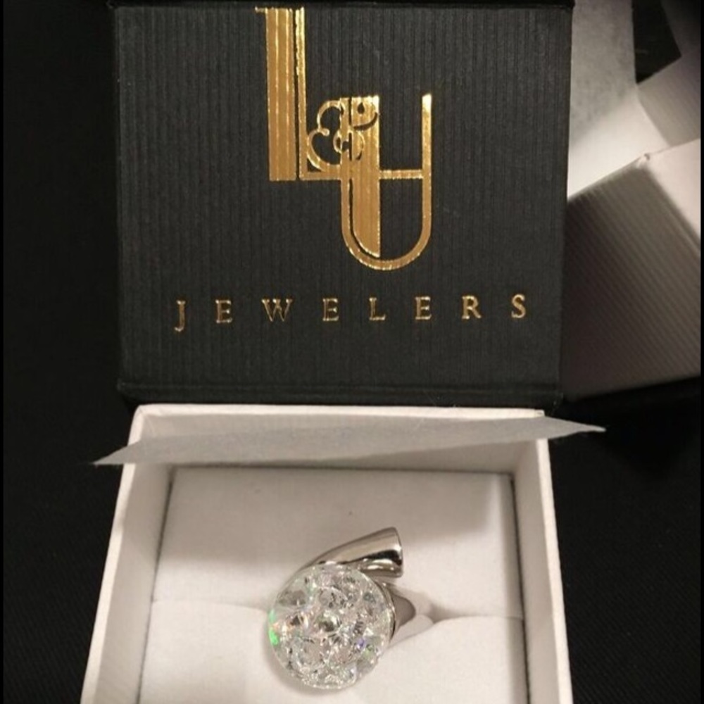 Floating cubic zirconia and sterling silver ring