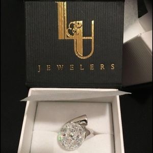 Floating cubic zirconia and sterling silver ring