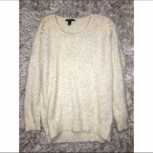 Cream fur and pearl sweater.