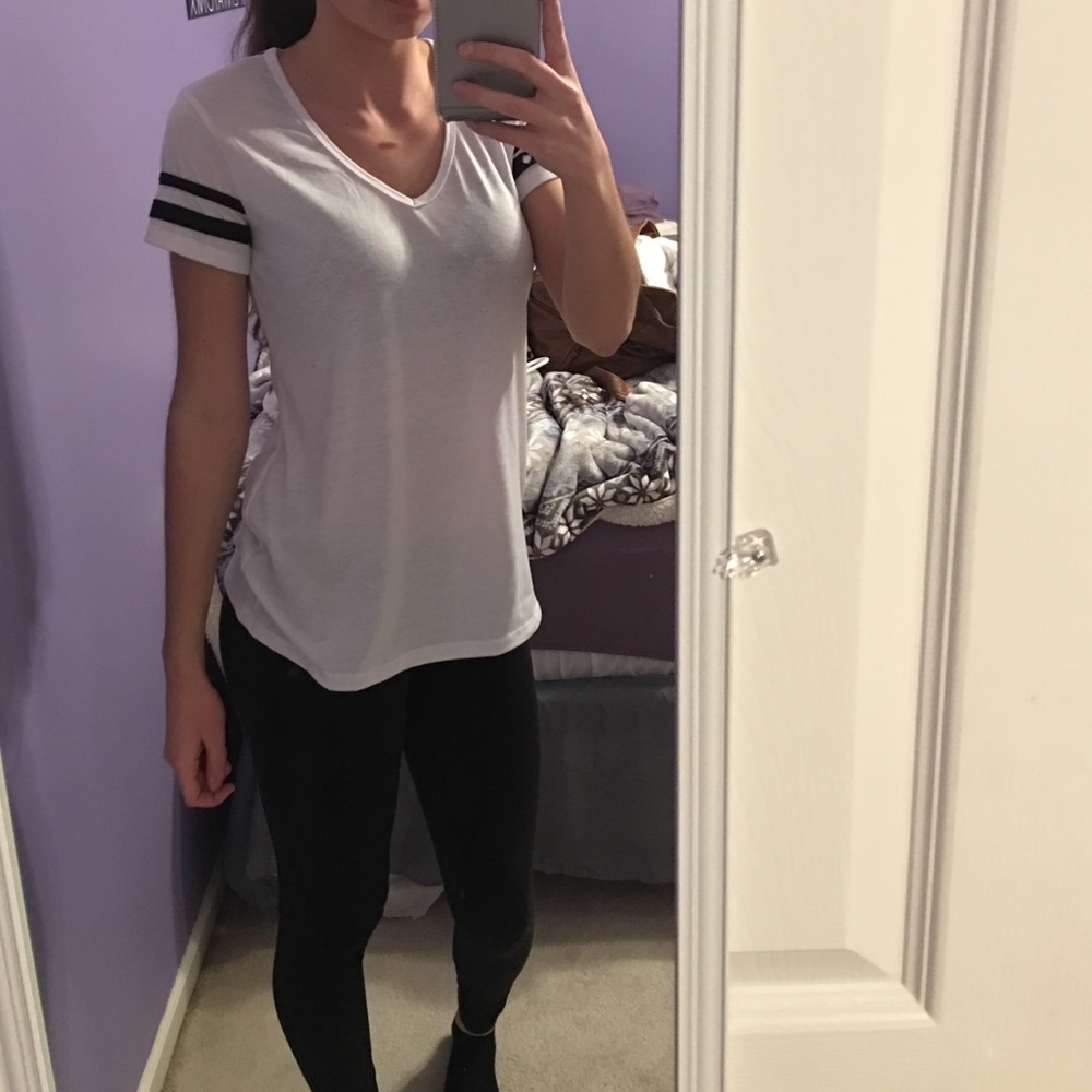 White shirt with black stripes on sleeves