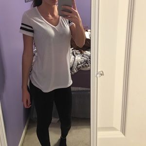 White shirt with black stripes on sleeves