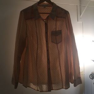 Pastel pink and black polka dot button up blouse.