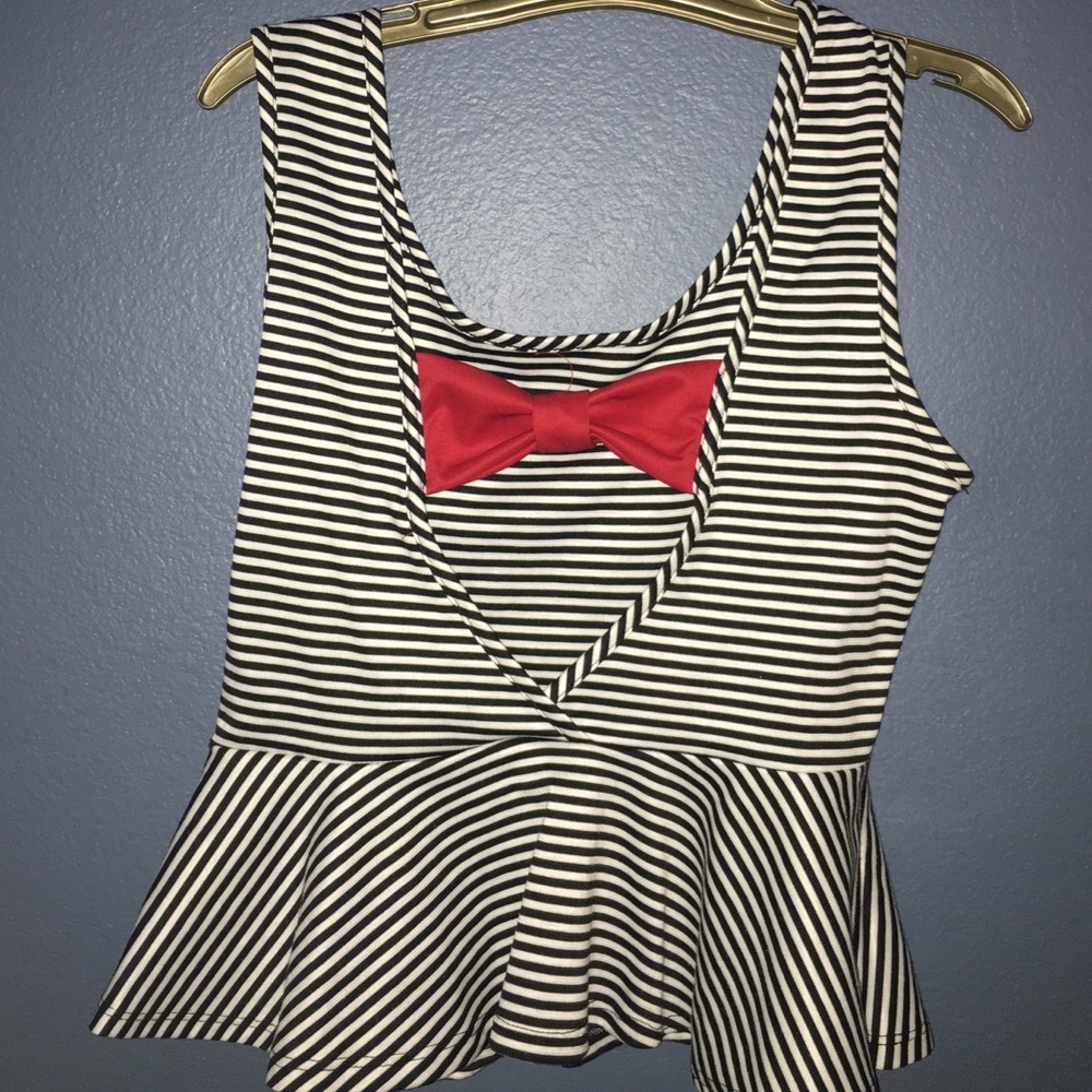 Striped shirt with red bow on open back