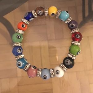 Evil eye bracket with diamond studs