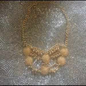 Gold costume choker necklace.