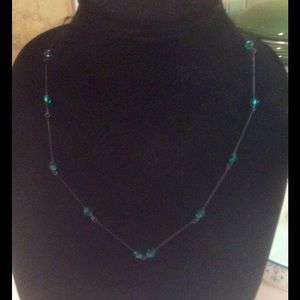 Necklace with black eyepins and faceted beads