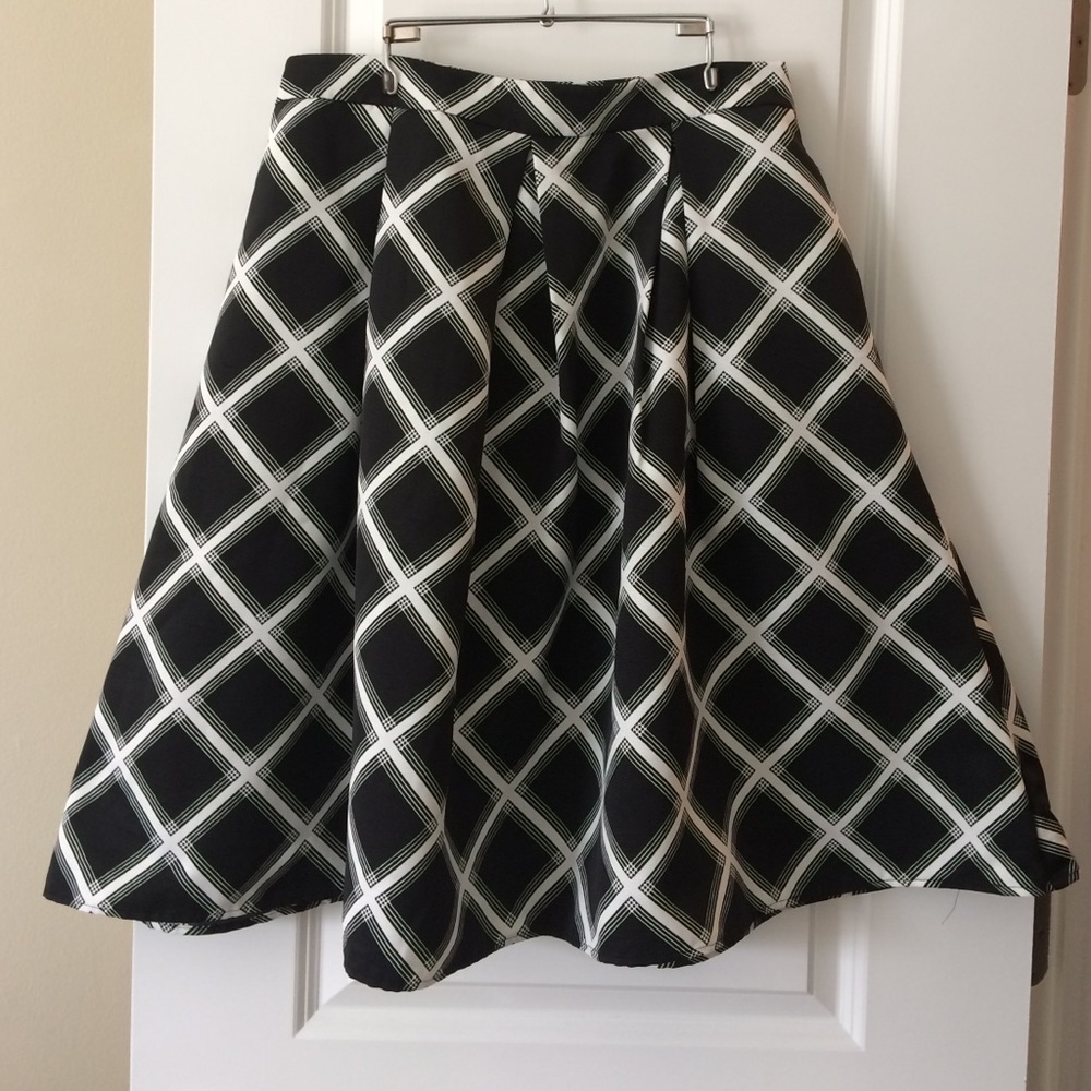 Express black and white plaid patterned skirt.